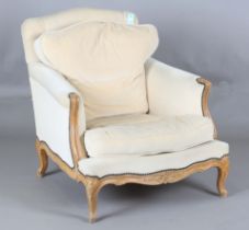 A 20th century French Louis XV style armchair with carved walnut frame, height 85cm, width 79cm,