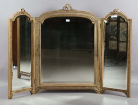An early 20th century Neoclassical Revival giltwood and gesso triptych dressing table mirror, height
