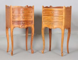 A pair of late 20th century French cherry bedside chests, each fitted with three drawers, on