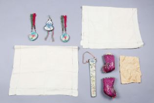 A group of 19th century and later Chinese textiles, including a silk embroidered purse, a pair of