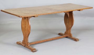 A 20th century mahogany refectory table, raised on shaped supports, height 73cm, length 183cm, depth