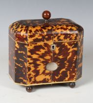 A Regency tortoiseshell tea caddy with overall metal stringing, the domed lid with patinated