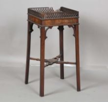 A George III Chippendale period mahogany kettle stand, the fretwork gallery above a pull-out slide