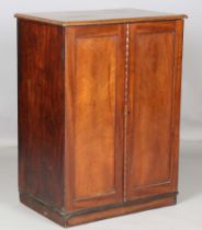 A Victorian mahogany collector's chest of eleven graduated drawers, enclosed by two panelled