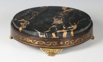 A Regency rosewood and brass inlaid display stand, the veined black marble top above a foliate