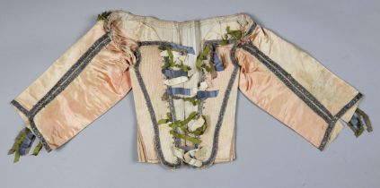 A rare pink silk pair of stays, probably 17th century, finely boned and with applied silver thread
