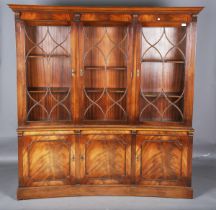 A late 20th century George III style mahogany concave fronted library bookcase, height 183cm,