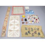 A mixed group of textiles, including silk ribbons, a gilt thread embroidered silk panel and a