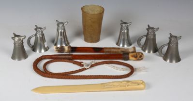 An early/mid-20th century leather hunting whip with novelty carved bone dog's head whistle/handle,