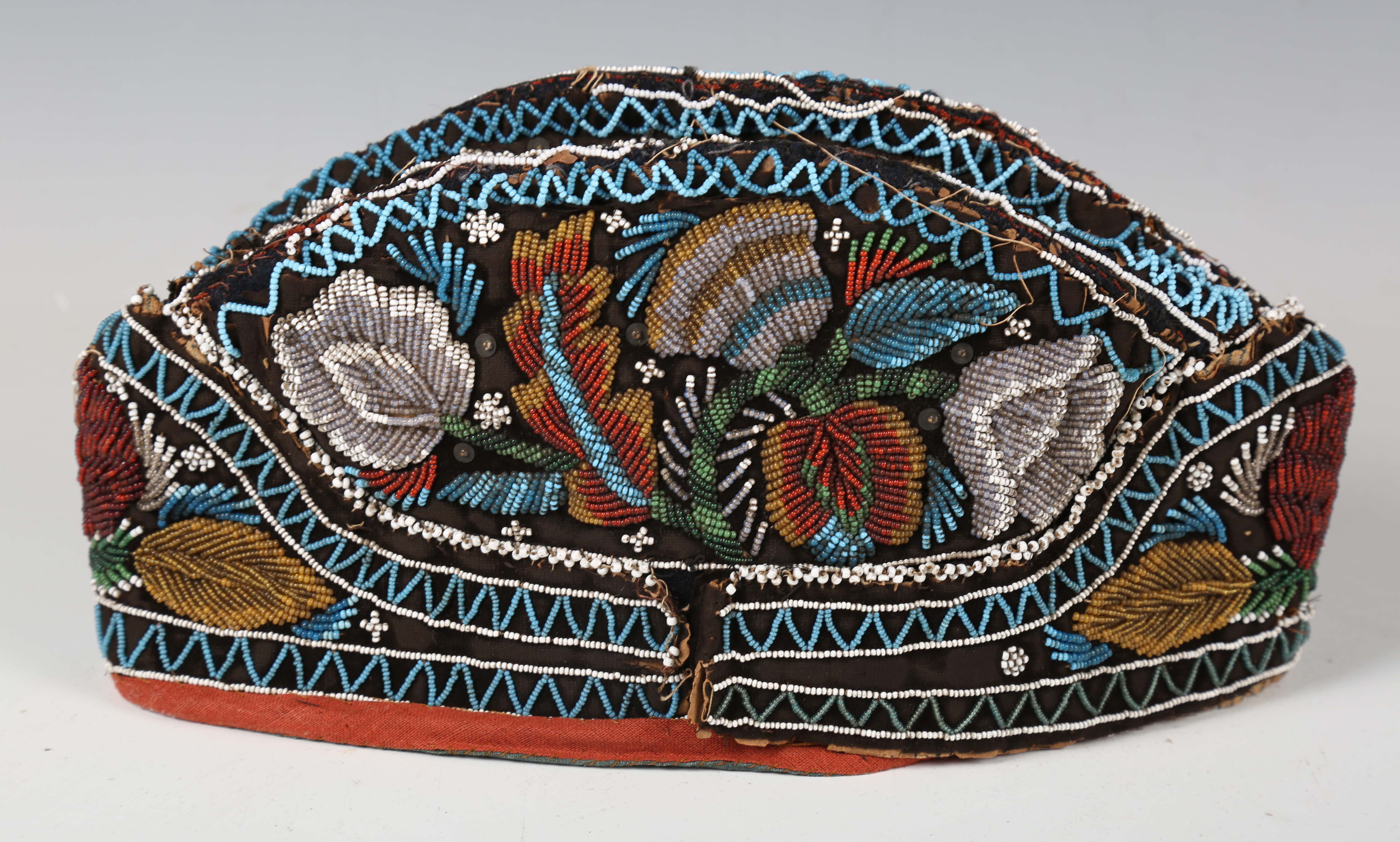 A 19th century beadwork and silk gentleman's cap, heavily beaded with flowers within zig-zag - Image 7 of 13
