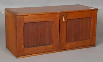 A late 19th century stained ash collector's chest of fourteen drawers, enclosed by two panelled