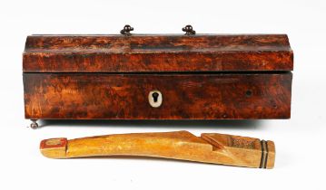 An early 19th century carved wooden knitting sheath, one end inset with a glazed panel,