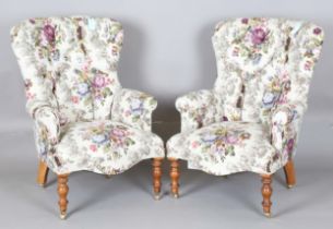 A pair of modern Victorian style buttoned back armchairs, upholstered in printed Sanderson fabric,