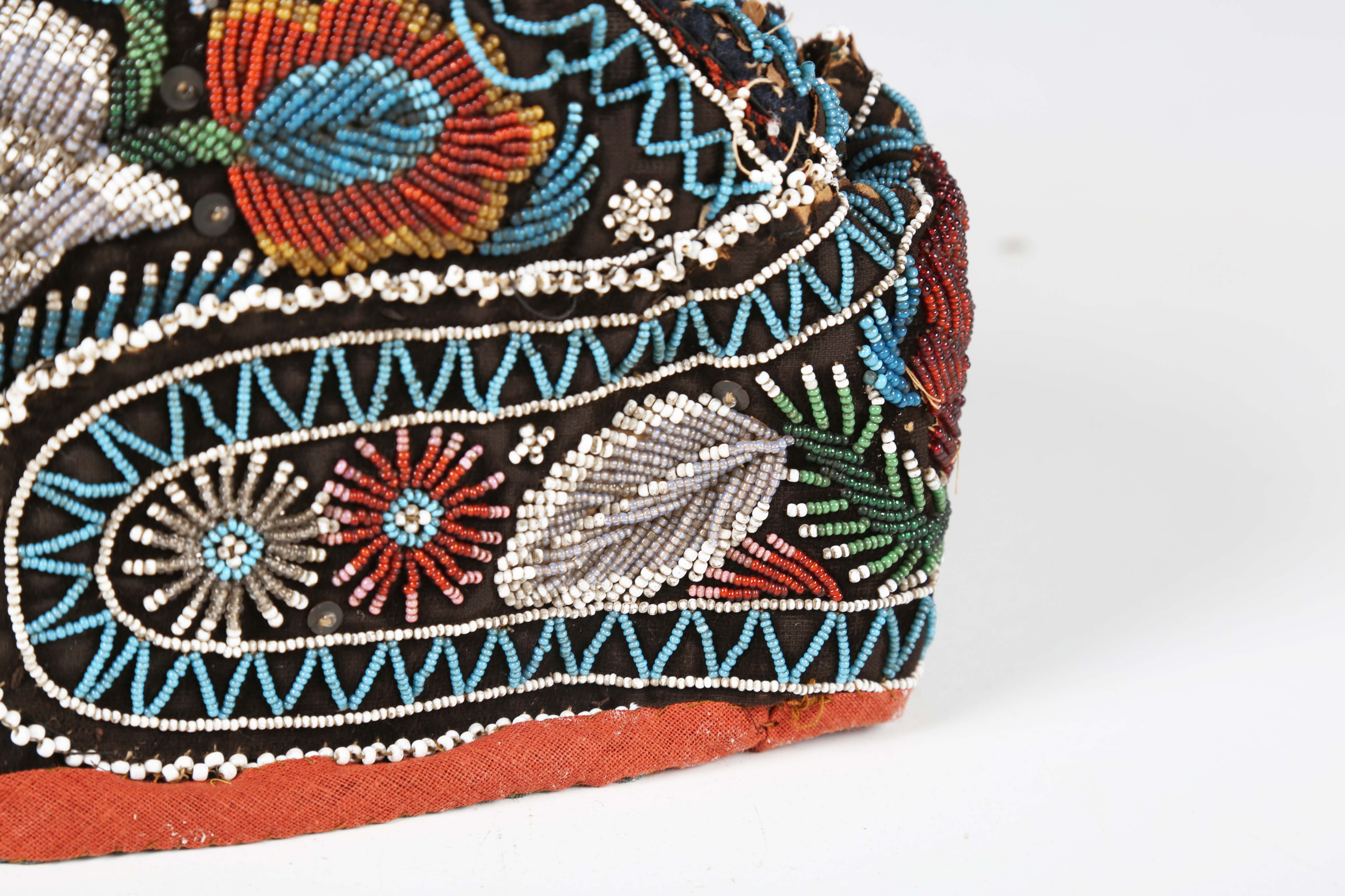 A 19th century beadwork and silk gentleman's cap, heavily beaded with flowers within zig-zag - Image 10 of 13