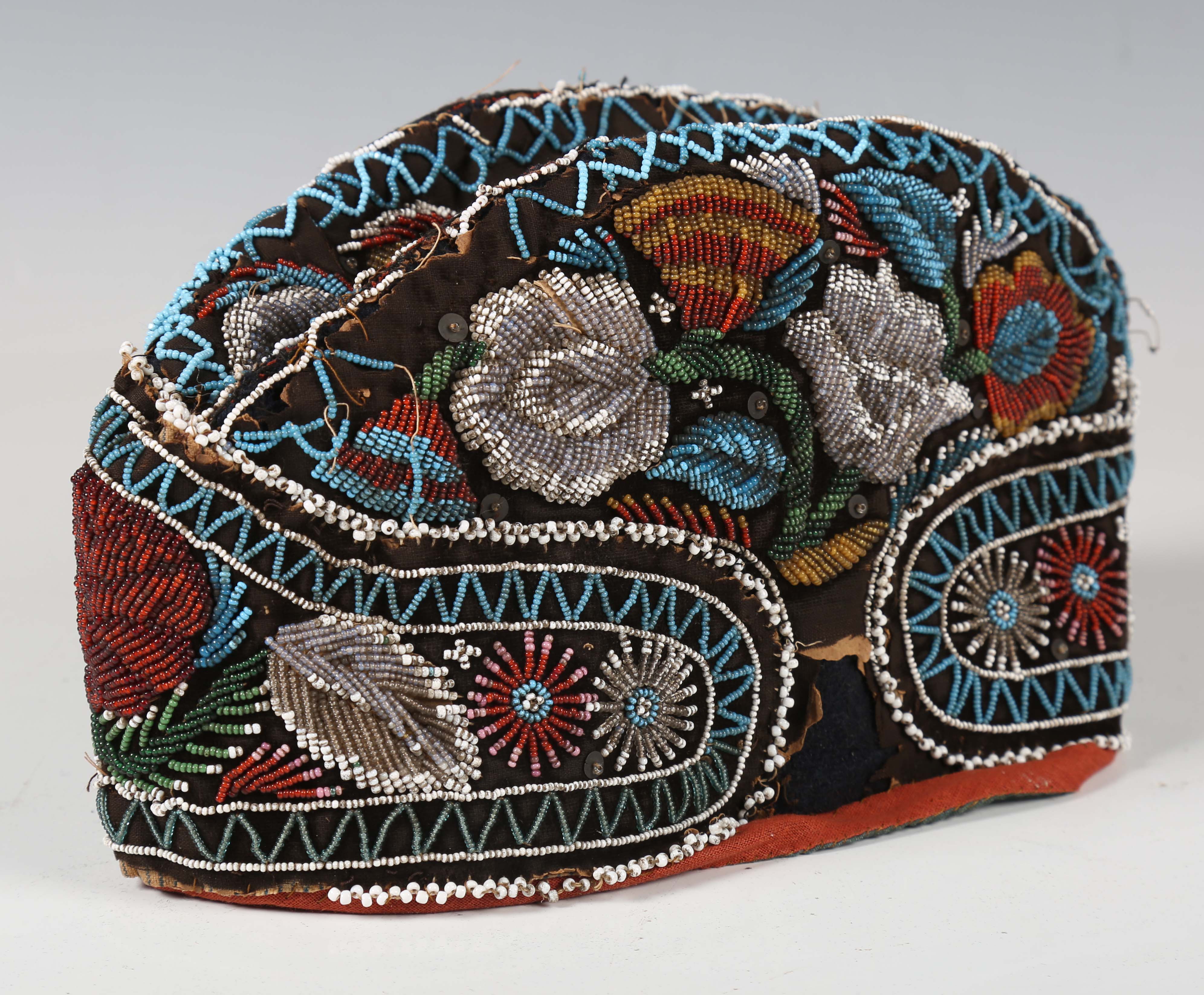 A 19th century beadwork and silk gentleman's cap, heavily beaded with flowers within zig-zag - Image 13 of 13