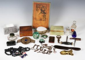 A group of collectors' items, including a gilt metal letter clip of hand form, two corkscrews, a