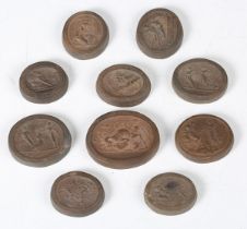 A group of ten Grand Tour moulded terracotta intaglio seals, all depicting relief impressions of