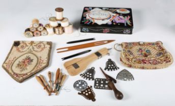 A collection of vintage textile patterns, various needlework equipment and a selection of buttons.