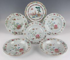 A group of six Chinese famille rose export porcelain soup plates, Qianlong period, comprising five