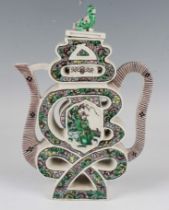 A Chinese famille verte enamelled biscuit porcelain teapot and cover with Buddhistic lion cub