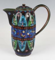 A Japanese cloisonné jug and cover, Meiji period, of lobed form, decorated with panels of polychrome