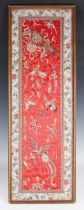 A Chinese silk embroidered rectangular panel, late Qing dynasty, worked in coloured threads with