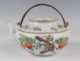 A Chinese famille rose porcelain teapot and cover, late Qing dynasty, of ribbed circular form,