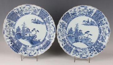 A pair of Chinese blue and white export porcelain circular dishes, Kangxi period, each painted