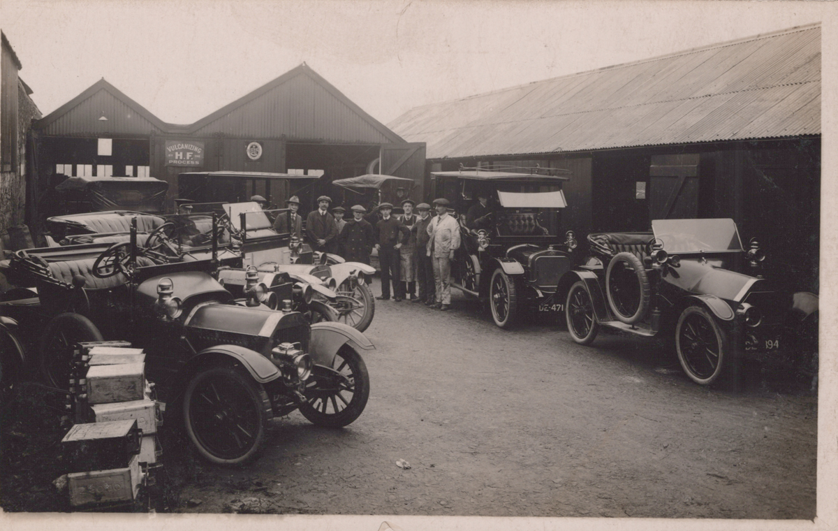 GARAGES. An album containing approximately 64 postcards, photographs and reprints of motorcar - Image 7 of 9