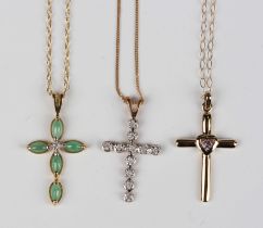 A 9ct gold, jade and diamond pendant cross, mounted with five marquise shaped jades surrounding a