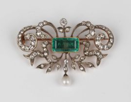 A gold backed, diamond, emerald and seed pearl brooch, circa 1900, in a scroll pierced and foliate