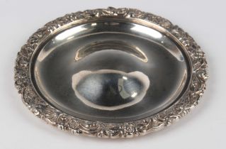 A William IV silver circular wine funnel stand, the rim cast with flowers and foliate scrolls,