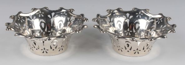 A pair of Edwardian silver circular bonbon dishes, each of flared circular form with pierced