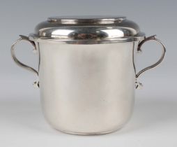 An Edwardian silver two-handled cup and stepped cover, the cylindrical body with slightly flared