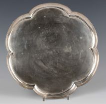 An Elizabeth II silver tray of lobed circular outline with raised rim, London 1966 by William Comyns