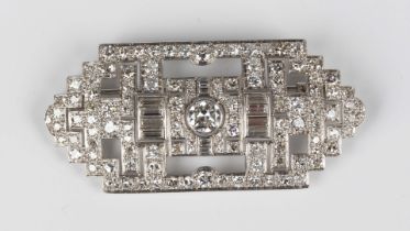 An Art Deco platinum and diamond plaque brooch, circa 1930, in a geometric design, mounted with