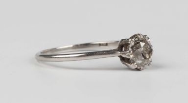 A diamond single stone ring, mounted with a cushion cut diamond, indistinct mark, weight 2.4g,