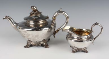 An early Victorian silver circular teapot with seed head and leaf finial, flanked by a foliate
