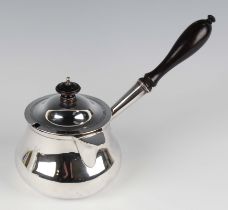 A George IV silver brandy pan and slightly domed cover of low-bellied circular form with lidded