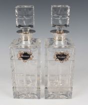 A pair of Elizabeth II silver mounted square cut glass decanters and square stoppers, height 29.5cm,