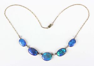 An Edwardian gold, black opal doublet and diamond necklace, the front collet set with a row of