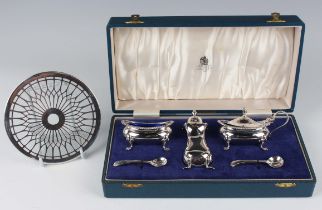 An Elizabeth II silver three-piece condiment set of oval form with gadrooned rims, comprising