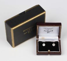 A pair of diamond single stone earstuds, each claw set with an old European cut diamond, with post