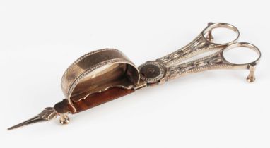 A pair of George III silver candle snuffers, the handles cast and pierced with bellflowers within