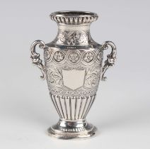 A William IV silver posy vase of flattened two-handled urn form, decorated with a floral medallion