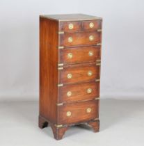 A 20th century reproduction mahogany and brass bound military style chest of drawers, fitted with