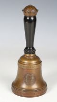 An early 20th century Danish patinated cast bronze presentation hand bell, inscribed in Danish