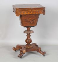 A mid-Victorian rosewood work table, the hinged lid revealing a tapering well, raised on a
