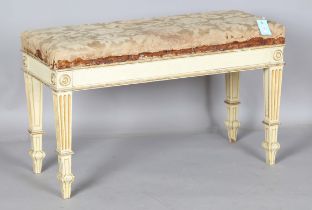 An early 20th century cream painted and gilt decorated duet piano stool by Spillman & Co, London,