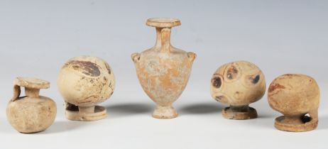 A group of four Greek Corinthian aryballoi, circa 6th century BC, the largest with remnants of